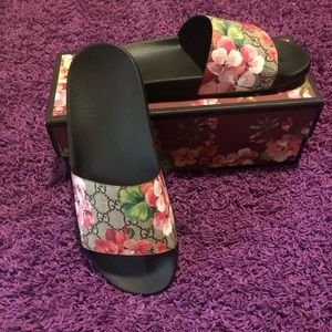 Brand new Gucci slides in box .